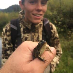 Jack marvels at a small frog.